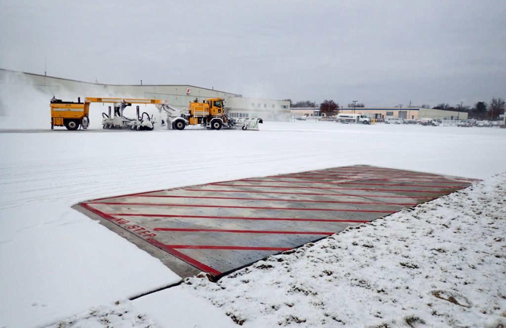 Iowa State engineers don't need a plow to clear snow from the heated test slabs they installed at the Des Moines International Airport. Photos courtesy of Halil Ceylan.