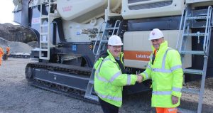 Mr. David Strachan, Quarry Manager Northfield Quarry, Tillicoultry Quarries, received the keys from Mr. Michael Broe, Director, Garriock Bros. Ltd.