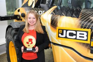 JCB Higher Apprentice Louise Meredith with her Apprentice of the Year Award at JCB's World HQ in Rocester