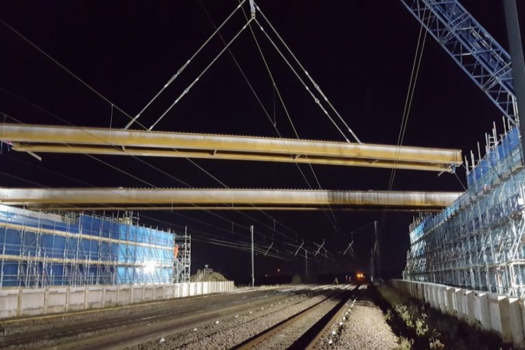New A14 Cambridge to Huntingdon bridge beams lifted over major railway line