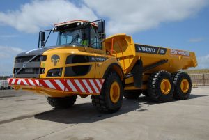 The first arrival is the Volvo A25G articulated hauler