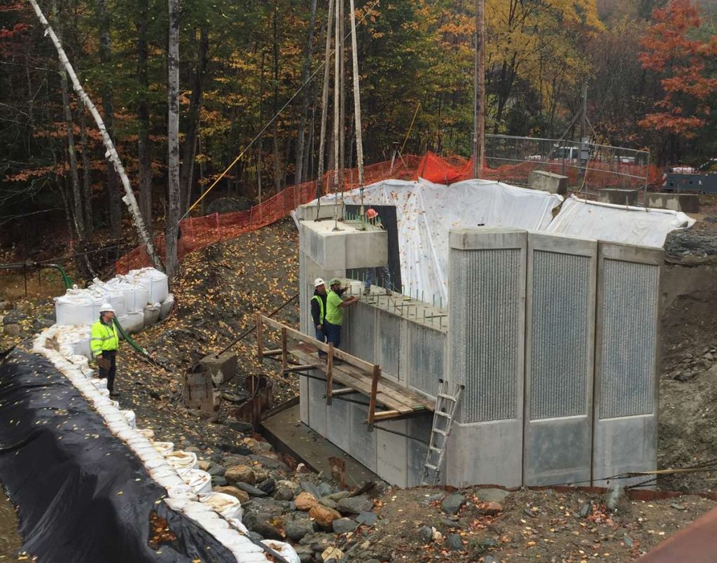 Mass DOT Replaces Savoy Road Bridge over the Chickley River Using Accelerated Bridge Construction. Bridge substructure is composed of all precast concrete bridge components for fast-track construction