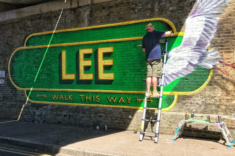 Street artist and sign writer Lionel Stanhope transforms London's railway bridges with art