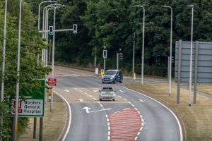 An innovative scheme integrating wireless vehicle detection traffic signals, vehicle activated signs (VAS) and a hurry call system has reconfigured a hospital junction to address safety concerns and assist ambulance response times.
