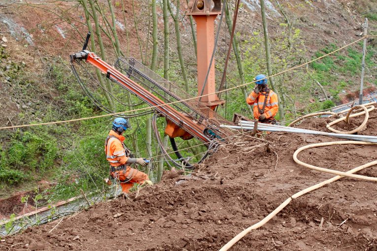 Network Rail's abseiling teams working to protect railway cutting from rockfalls