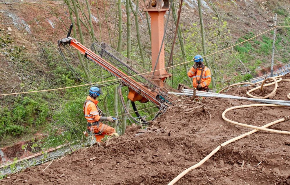 Network Rail's abseiling teams working to protect railway cutting from rockfalls