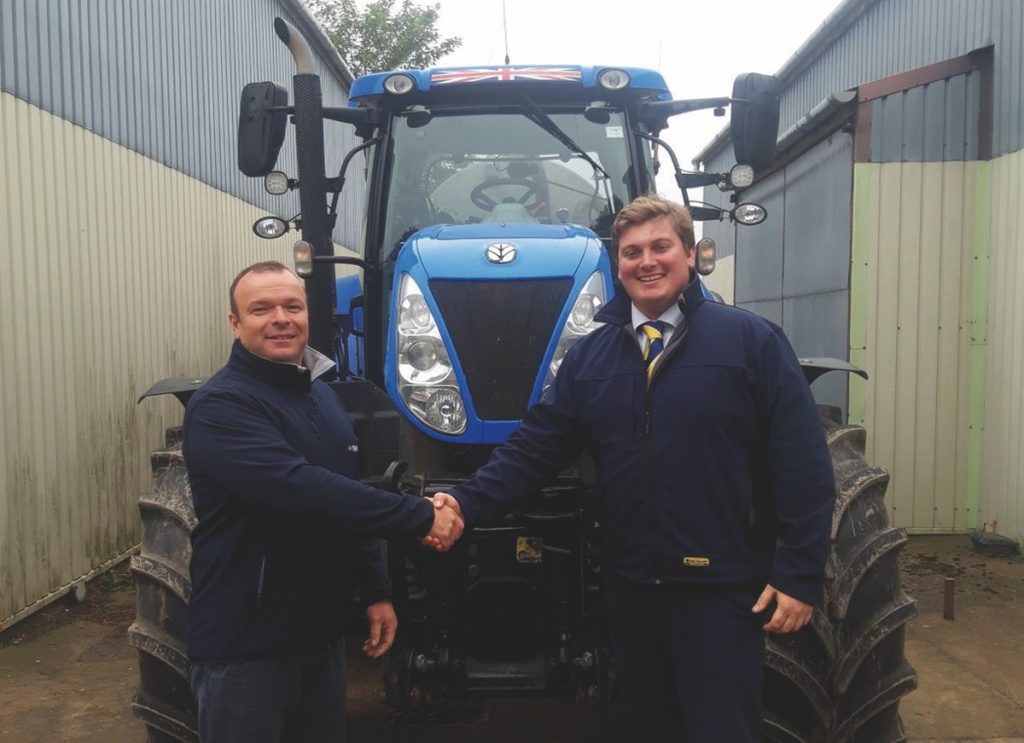 David Evans is welcomed to New Holland by George Mills, New Holland Area Sales Manager.