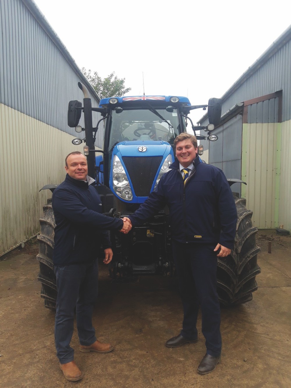 David Evans is welcomed to New Holland by George Mills, New Holland Area Sales Manager.