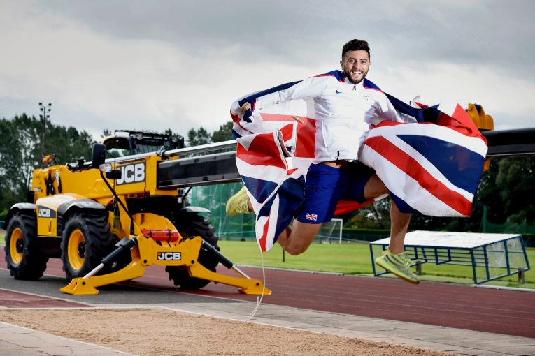 British athlete jumping for joy after landing JCB sponsorship