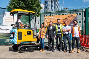 from left to right are Tutor Dean Cox, Operations Director of SCSC John White, Trainee Project Manager Louie Meates , JCB General Manager Charles Stevenson, Degree Apprentice for Construction Management Alexia Mikellides and Highways Apprentice Kevin Benn.