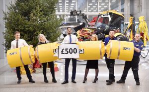 Pictured left to right are Systems Developer Yunus Bozkurt, 21, of Rugeley; Assembly Line Operative Kate Williams, 19, of Church Leigh, near Uttoxeter; JCB Access Sales employee Eamon Johal, 24, of Derby; HR Administrator Faye Morrall, 29, of Tutbury, near Burton; Team Leader Jon Ward, 29, of Stafford and Team Leader Craig Scott, 37, of Longton, Stoke-on-Trent celebrate the news of the JCB employee bonus