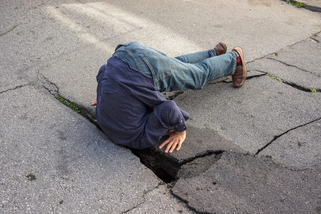 Pothole Photo by Peretz Partensky