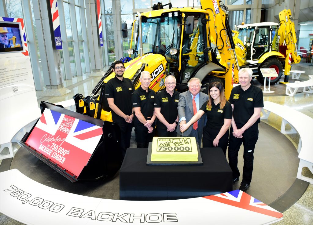 Pictured left to right are Nihal Dhillon, Phil Starbuck, John Plant, JCB Chairman Lord Bamford, Shannon Ramczykowski and Keith Bloor celebrating the production of the 750,000th JCB backhoe loader at JCB World HQ, Rocester, Staffordshire.