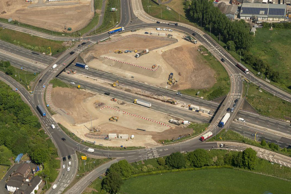 Two aerial close-ups of the centre of the roundabout and M6 carriageways showing verge and central reservation piers taking shape. Photo © Copyright 360photosurvey.com 2020 all rights reserved