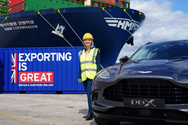 Liz Truss catches a glimpse of the Aston Martin DBX as they get set to sail to the US