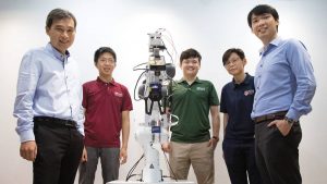 The National University of Singapore research team behind the novel robotic system integrated with event-driven artificial skin and vision sensors was led by assistant professor Harold Soh (left) and assistant professor Benjamin Tee (right). With them are team members (second from left to right) Sng Weicong, Tasbolat Taunyazov and See Hian Hian. (Credit: National University of Singapore)