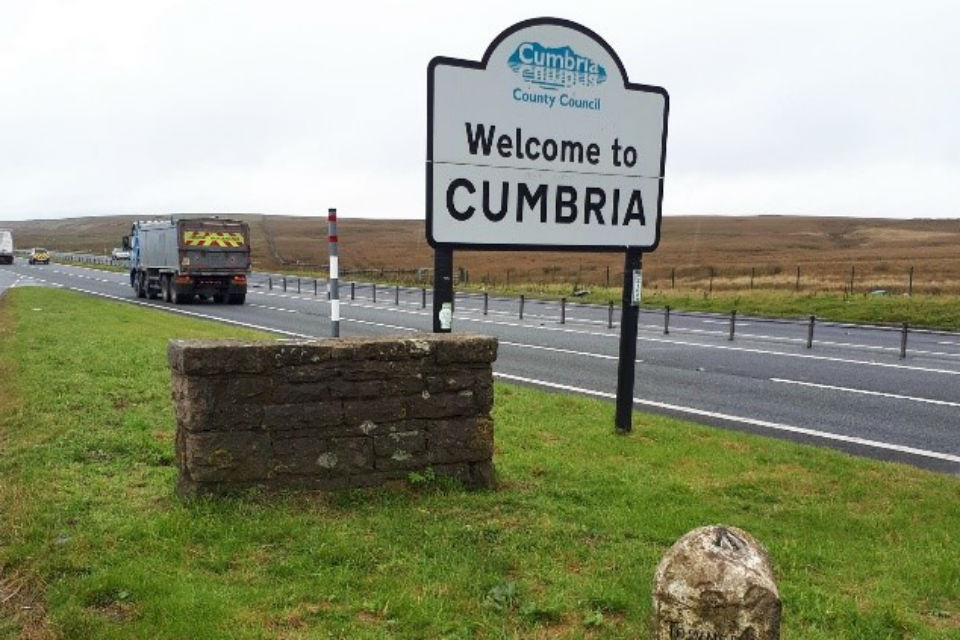 The ancient marker stone (foreground) - before its renovation and relocation elsewhere on the site - is pictured alongside the A66 right on the historic border between Cumbria and County Durham.