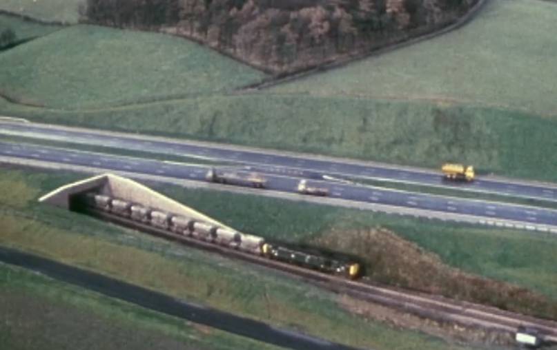 The newly-opened motorway running alongside the main Lancaster to Carlisle railway line - now part of the West Coast mainline. Images from Laing’s 30 minute documentary courtesy British Film Institute.