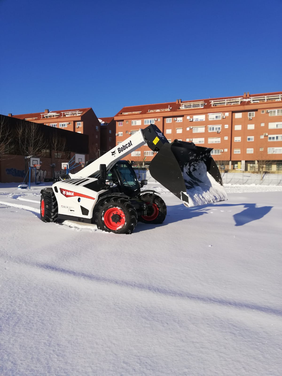 Bobcat get stuck into digging Madrid out of the snow