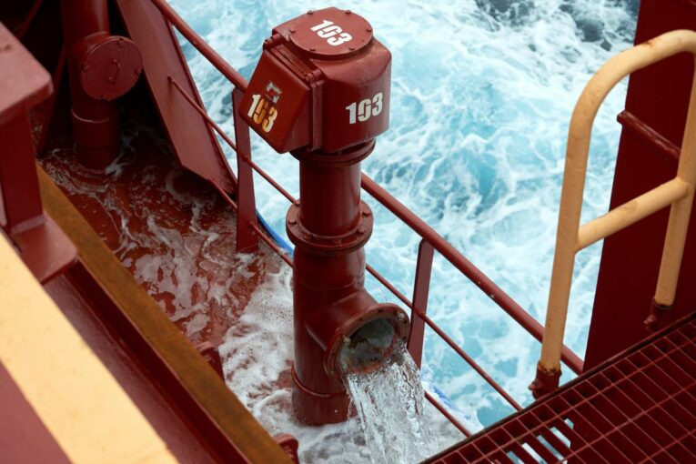 Inhibit corrosion in vessels containing saltwater or brine