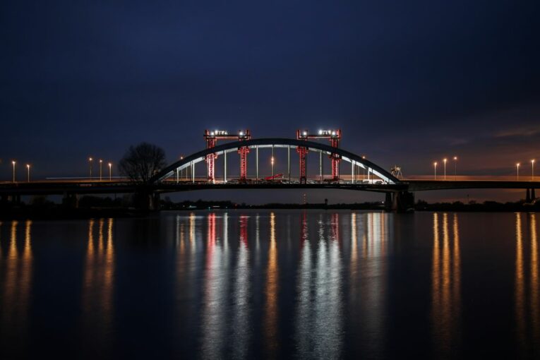 Mammoet moves Vianen steel-arched bridge at night in the Netherlands