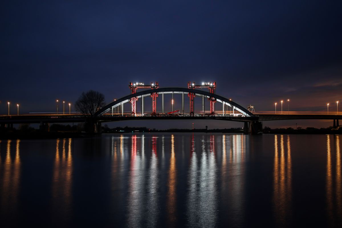 Mammoet moves Vianen steel-arched bridge at night in the Netherlands
