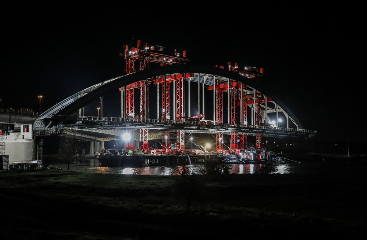 Mammoet moves Vianen steel-arched bridge at night in the Netherlands