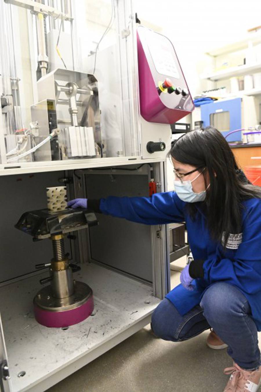 Johns Hopkins University Johns Hopkins graduate student Beijun Shen places liquid crystal elastomer structure in drop tester machine.