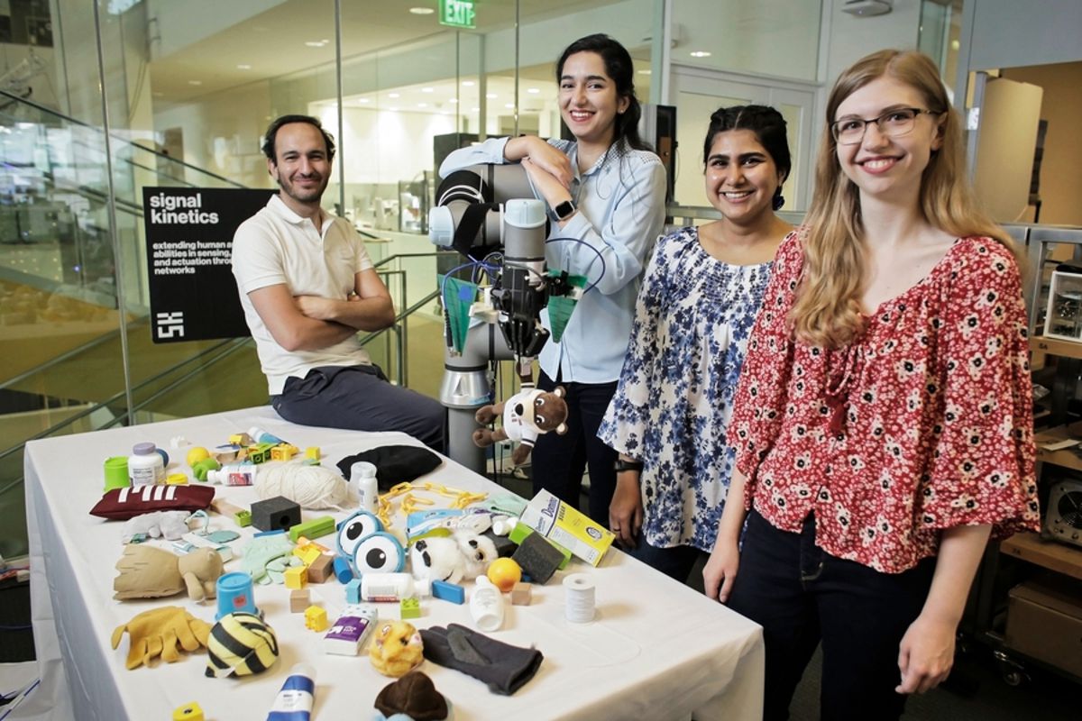 Fadel Adib, associate professor in the Department of Electrical Engineering and Computer Science and director of the Signal Kinetics group in the MIT Media Lab (far left) with (from left to right) Tara Boroushaki, Nazish Naeem, and Laura Dodds, research assistants in the Signal Kinetics group. Credits:Image: James Day, MIT Media Lab