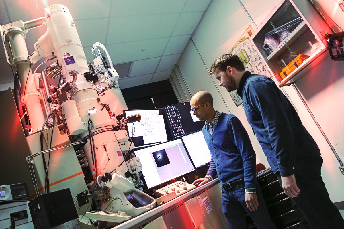 Credit: Lonnie Anderson, Sandia National Laboratories In this photo from 2020, Christopher Barr, right, a former Sandia National Laboratories postdoctoral researcher, and University of California, Irvine, professor Shen Dillon operate the In-situ Ion Irradiation Transmission Electron Microscope. Barr was part of a Sandia team that used the one-of-a-kind microscope to study atomic-scale radiation effects on metal.