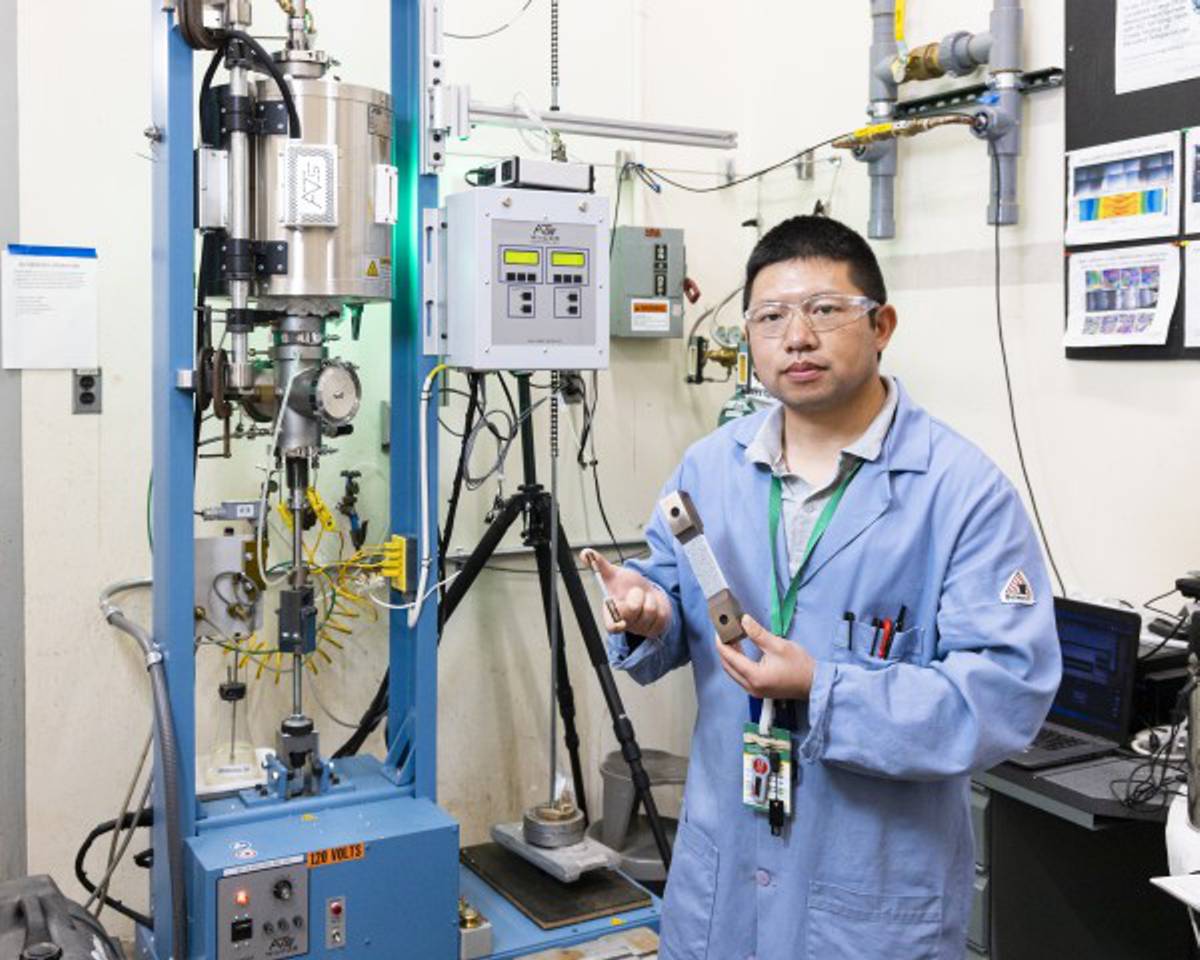 Credit: Carlos Jones/ORNL, U.S. Dept. of Energy Yiyu Wang, a scientist in Feng’s group, tests and characterizes materials to determine how welding affects microstructure. His work proves the weld wire lowers stresses.
