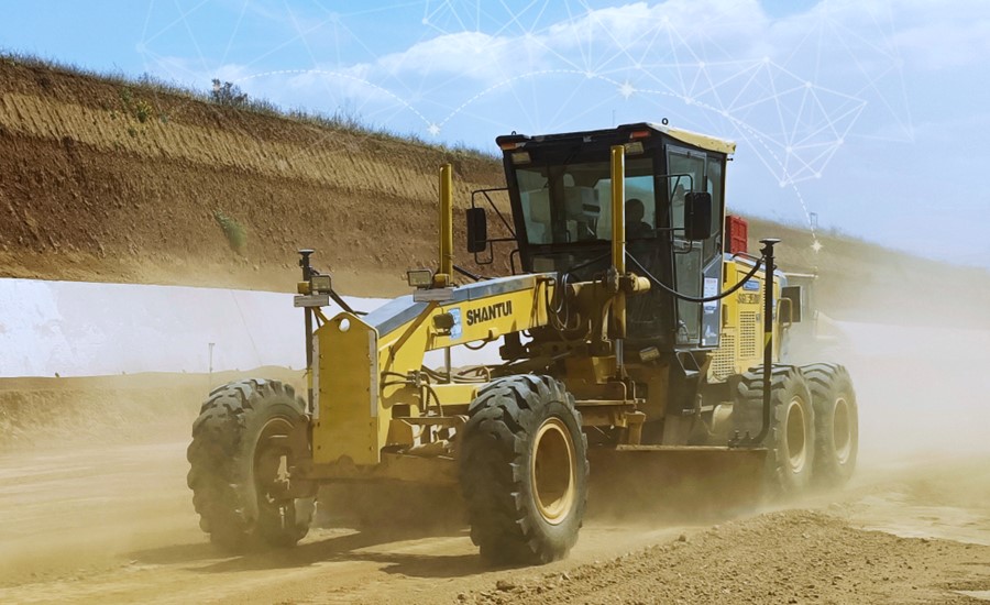 The TG63 (installed on the grader), a high-accuracy automatic GNSS/INS grade control system that is designed to improve the quality and efficiency of grading operations.