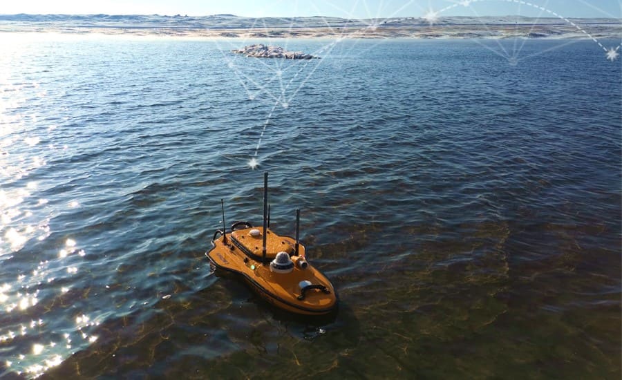 The Apache 3 USV, equipped with the GNSS IMU sensor and single beam echosounder, takes a bathymetric survey in the freezing lake water.