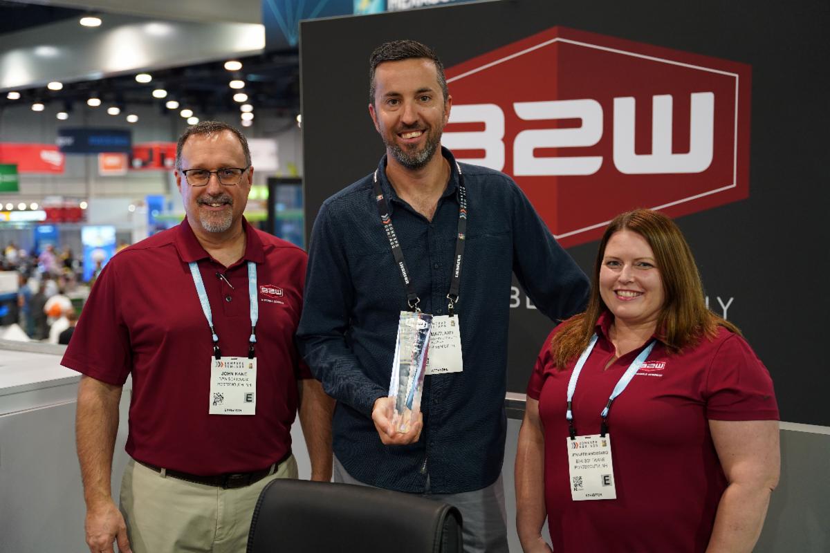 Dan Maitland of Ajax Paving (middle) with B2W’s John Kane and Jennifer Angrisano (left to right) accept the 2023 Best ROI with a Single B2W Application award for the company’s success with B2W Maintain.