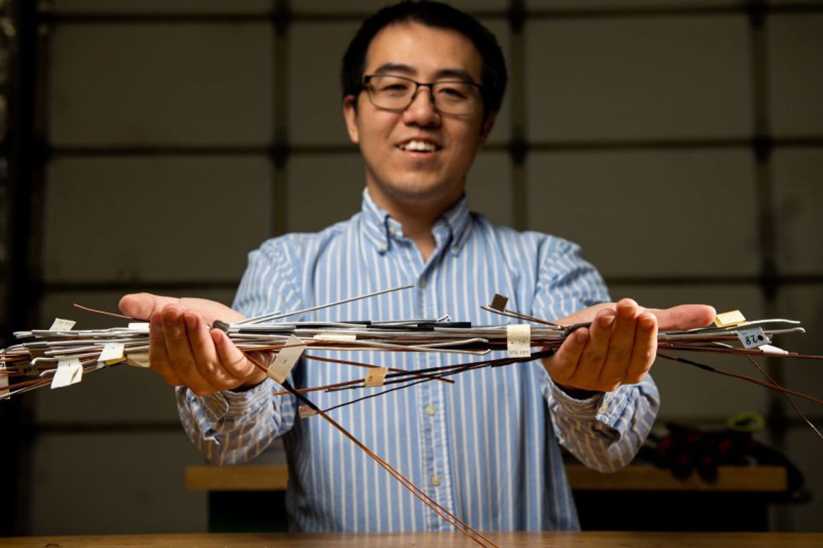 Credit: (Photo by Andrea Starr | Pacific Northwest National Laboratory) Xiao Li, a materials scientist, holds samples of highly conductive metal wires created on the patented Shear Assisted Processing and Extrusion platform.