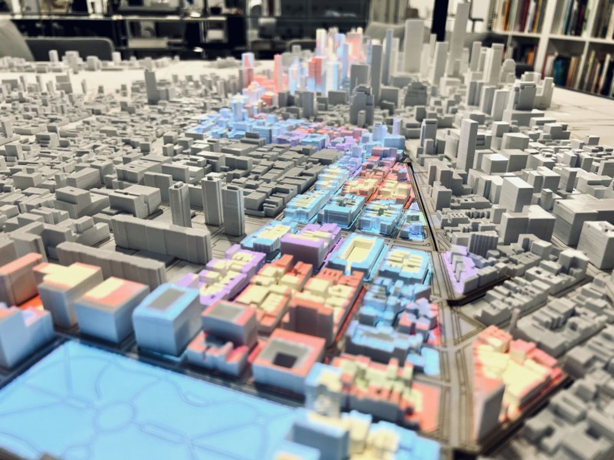 Credit: Credit: Fengqi Li/ORNL, U.S. Dept. of Energy Caption: An interactive model demonstrates how a computer simulation framework, developed by Frank Li at Rensselaer Polytechnic Institute, can be used for city planning.