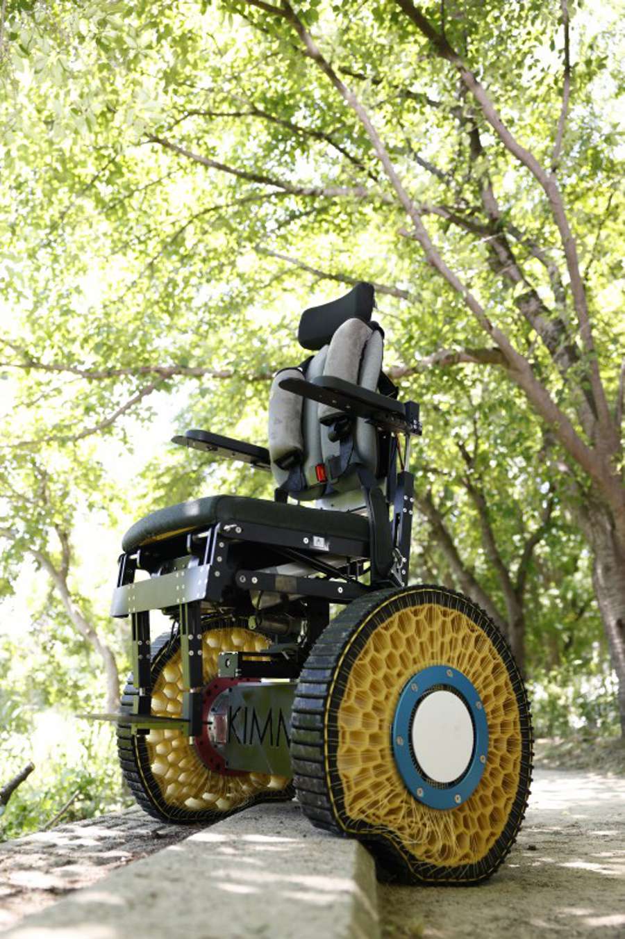 Credit: Korea Institute of Machinery and Materials (KIMM) A wheelchair featuring the variable-stiffness morphing wheel inspired by surface tension, overcoming an obstacle