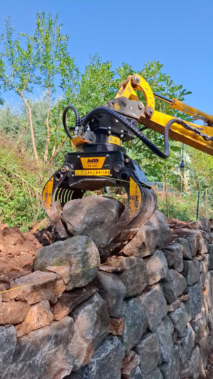 The Modern Revival of Dry Stone Walling with MB Crusher Attachments